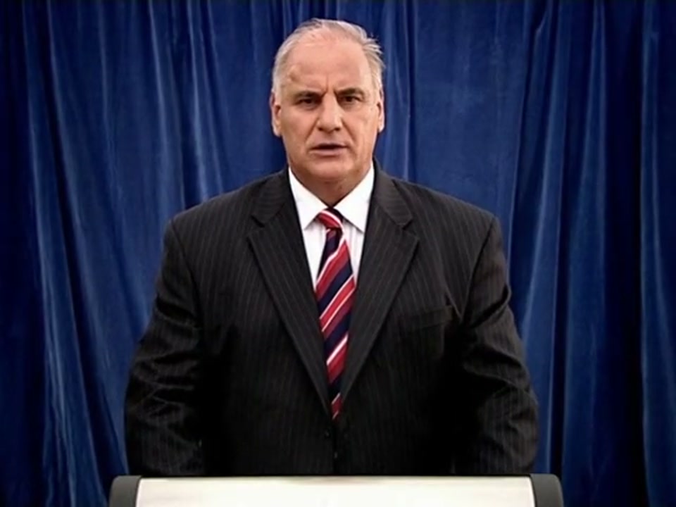 Address to the Nation (Australia Day Party) (2007), scene 4 at 01:00: Kekovich is back at the lectern. The scene then cuts to a bumper sticker reading "I ❤️ LA," which a hand covers with a sticker of Australia shaped like a lamb chop, reading "LAMB".