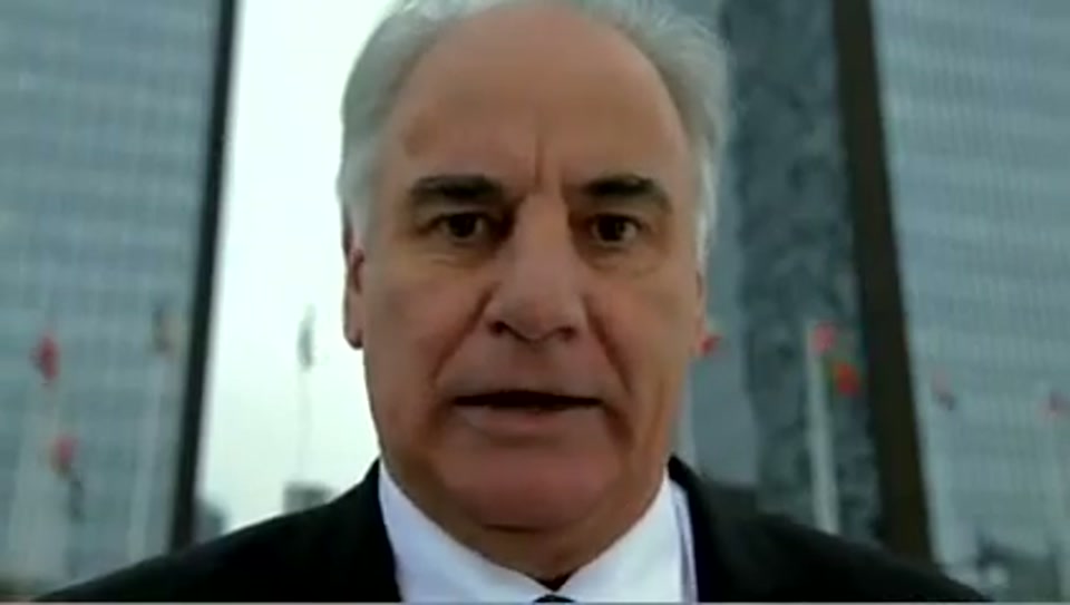 Address to the United Nations of Australia (2011), scene 5 at 00:57: Kekovich stands on the Spanish Steps in Rome. A montage follows: he poses with an attractive woman on a Lambretta scooter, is served Lambrusco wine in a restaurant, and sits in a silver Lamborghini.