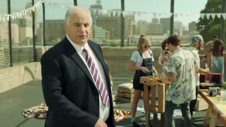 Generation Lamb (2014), scene 3 at 00:29: Kekovich approaches another family: two parents dressed in hippie-style clothing and their young son, who is wearing a singlet that says "Vegan and Proud." The parents are admiring a small potted plant.