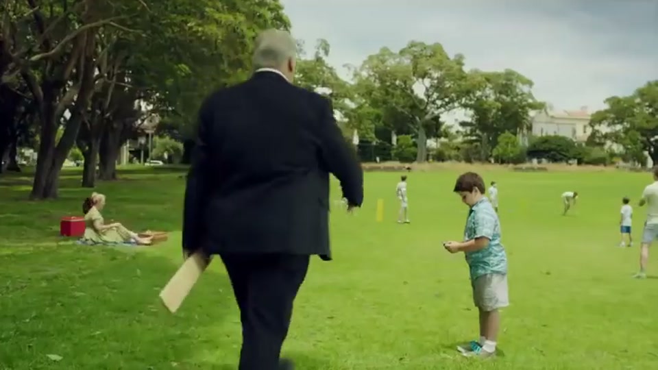 Generation Lamb (2014), scene 4 at 00:37: Kekovich is now in a green park. He walks up to a young boy sitting on the grass, engrossed in his smartphone. Kekovich takes the phone and hands the boy a cricket bat.