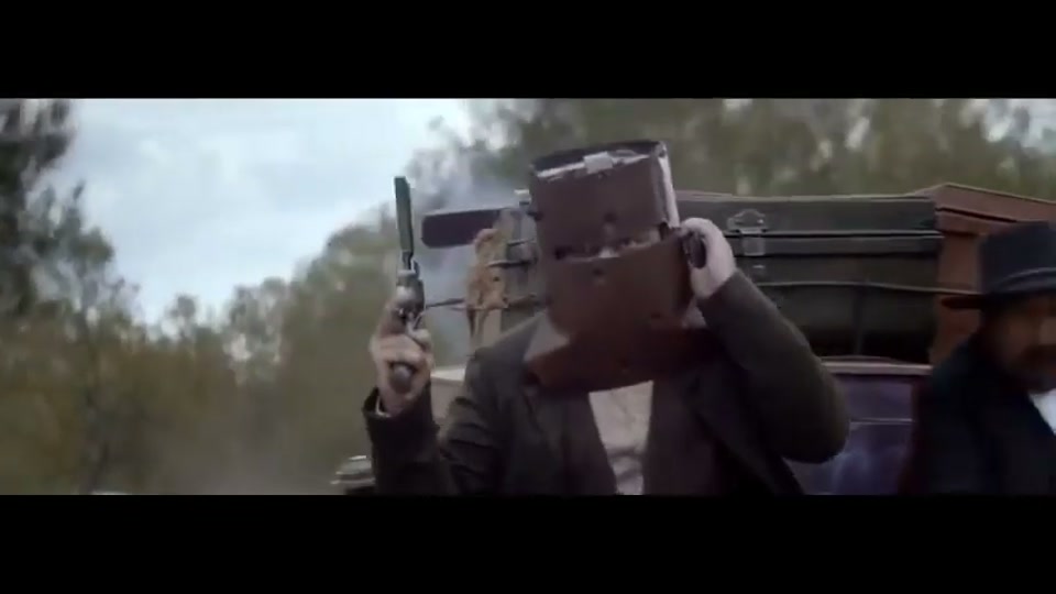 You Never Lamb Alone (Richie's BBQ) (2015), scene 5 at 01:28: The conference call continues, with rapid cuts between the historical and modern characters arguing. Cook smiles knowingly. Ned Kelly fires his pistol in the air for emphasis.