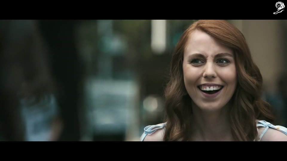 Lambalytica (2020), scene 1 at 00:11: The ad opens with an aerial shot of Sydney, transitioning to two young women walking down a city street, engrossed in their phones.