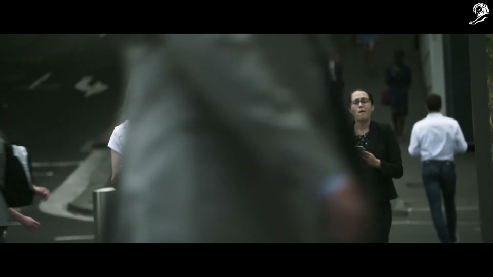 Lambalytica (2020), scene 1 at 00:03: The ad opens with an aerial shot of Sydney, transitioning to two young women walking down a city street, engrossed in their phones.