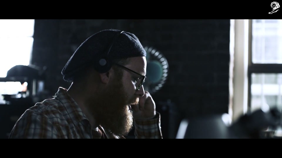 Lambalytica (2020), scene 3 at 00:36: An agent spots a disconnected couple in a Melbourne restaurant, both staring silently at their phones. The female executive orders him to intervene. He "deploys the wedding video," hacking the man's phone.