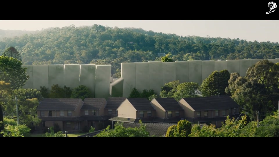 Make Lamb Not Walls (2021), scene 3 at 01:38: The crowd of onlookers charges towards the wall, armed with household items, sporting equipment, and garden tools. An elderly woman on a mobility scooter joins the charge.