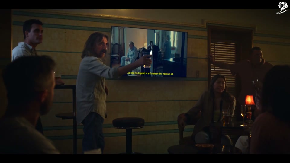 Un-Australian (2023), scene 2 at 00:59: The scene shifts to a classic, wood-panelled Australian pub. A series of patrons commit "Un-Australian" acts and vanish one by one. 1. A man cheats at pool by throwing the 8-ball into the pocket.